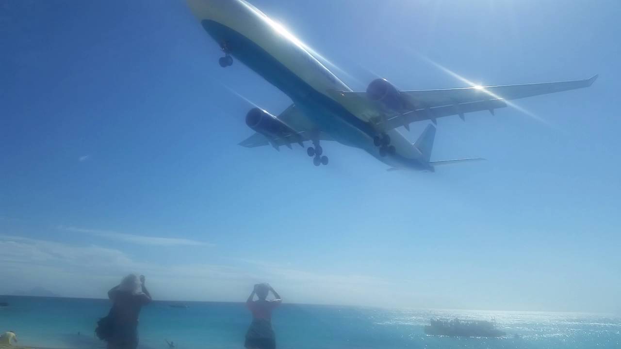 Sunset Beach Plane Flying Over Our Car