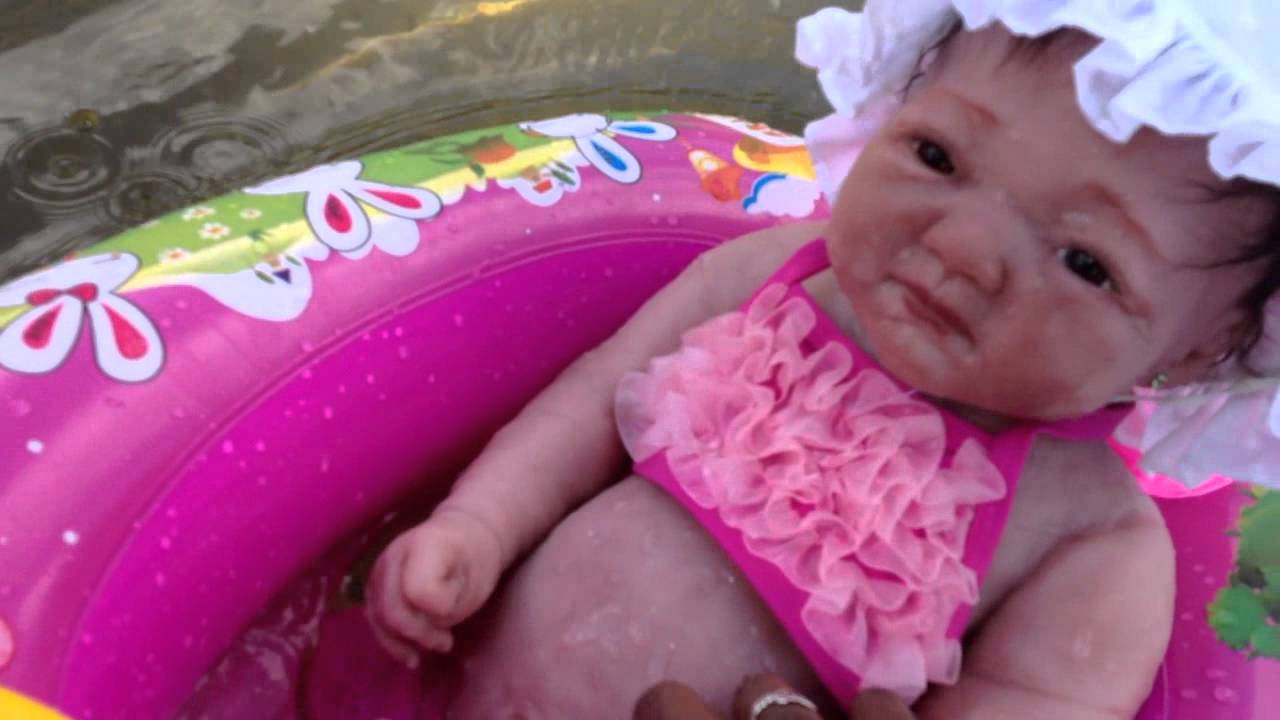 Silicone Baby Kaylee swimming at beach