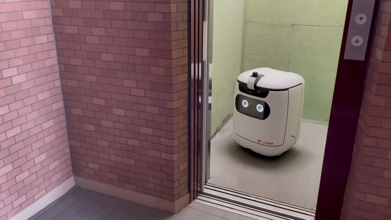 Japan Post , delivery experiment with autonomous mobile delivery robots at auto-lock apartment