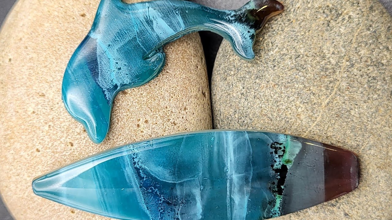 Surfboard and dolphin with ocean effect on polymer clay