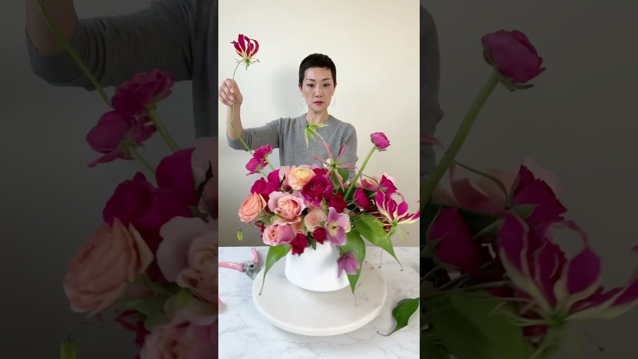 A Tropical Rose Arrangement. I use roses and spray roses as the main ingredients #flowerarranging
