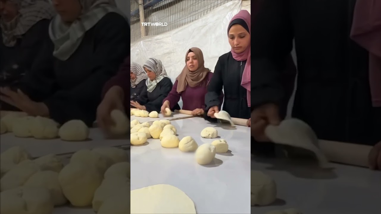 Palestinian women bake bread for displaced families in Gaza's Bureij Camp