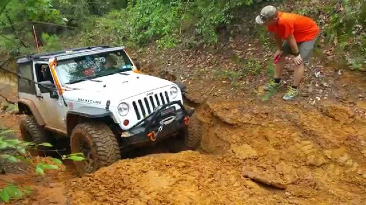Jeep JK Wrangler Rubicon on 37s climbing at Barnwell Mountain Gilmer, Texas