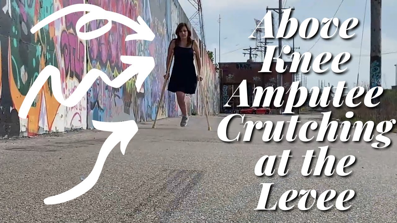 Above Knee Amputee with Wood Crutches at the Levee