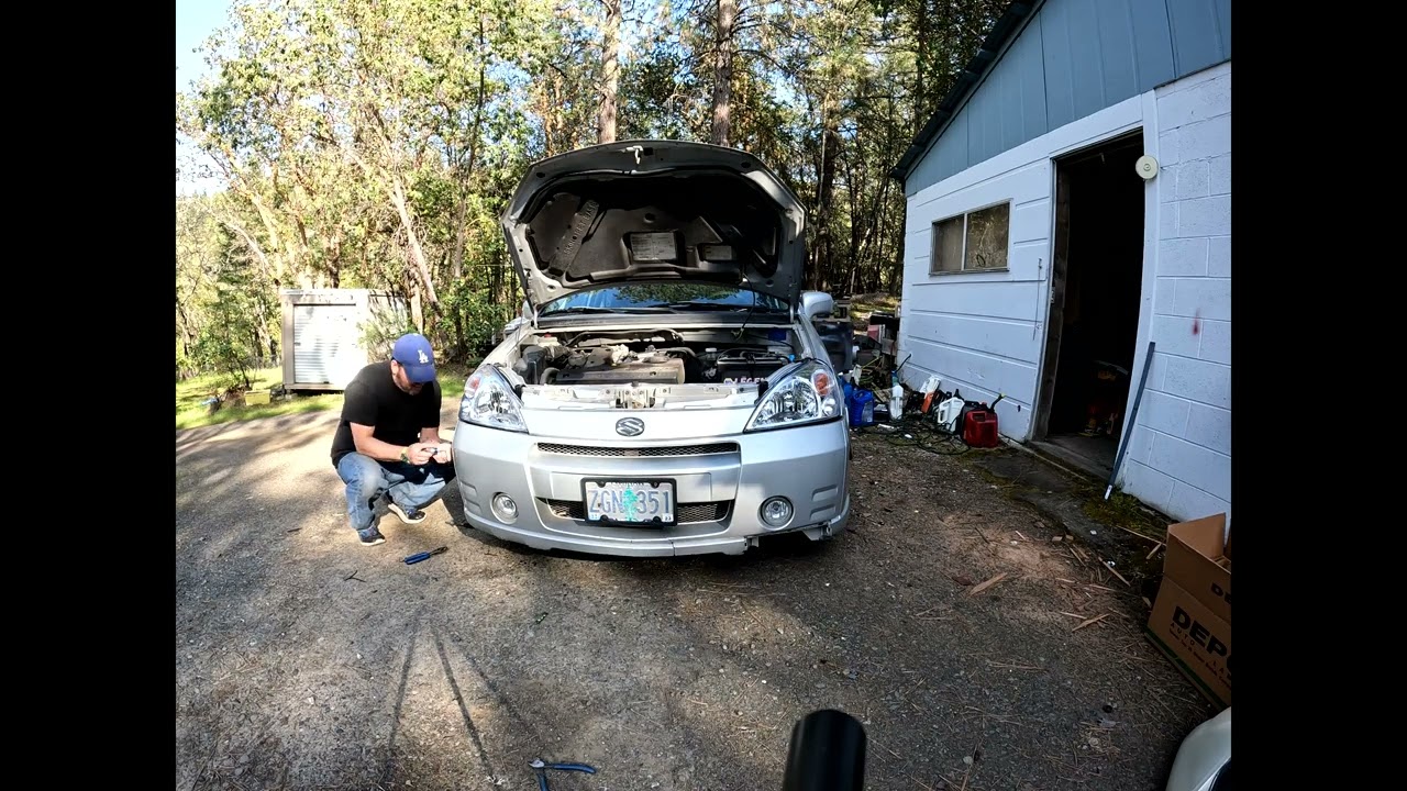 2003 suzuki aerio changing headlights
