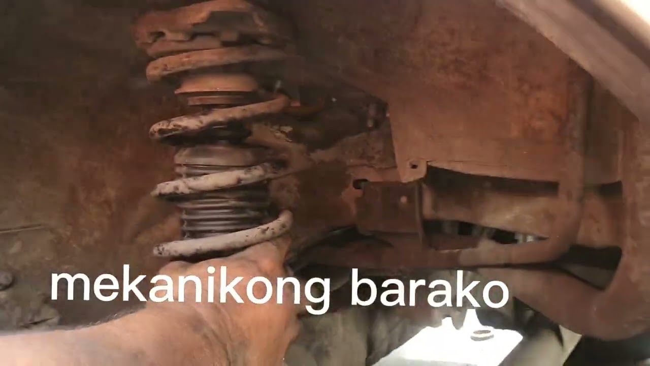 change rear shock absorbers & boots,NISSAN GX