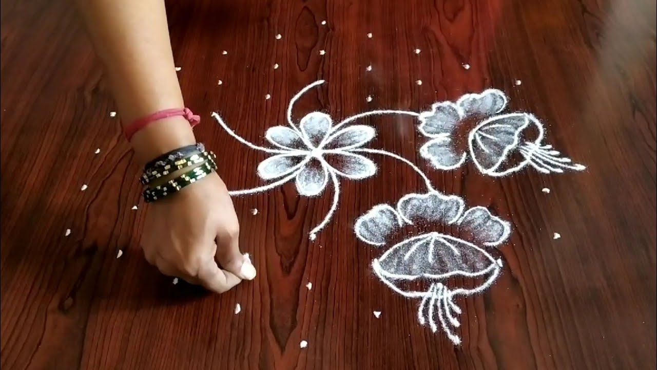 Simple & easy latest flower design rangoli (9×5) dots...