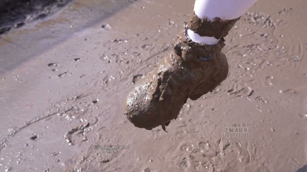 A white dress paired with sneakers trampling through the mud