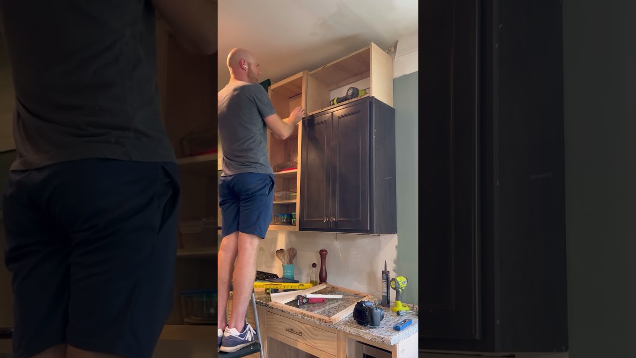 Installing the upper upper cabinets of our #kitchenrenovation. #diyhome #kitchenremodel