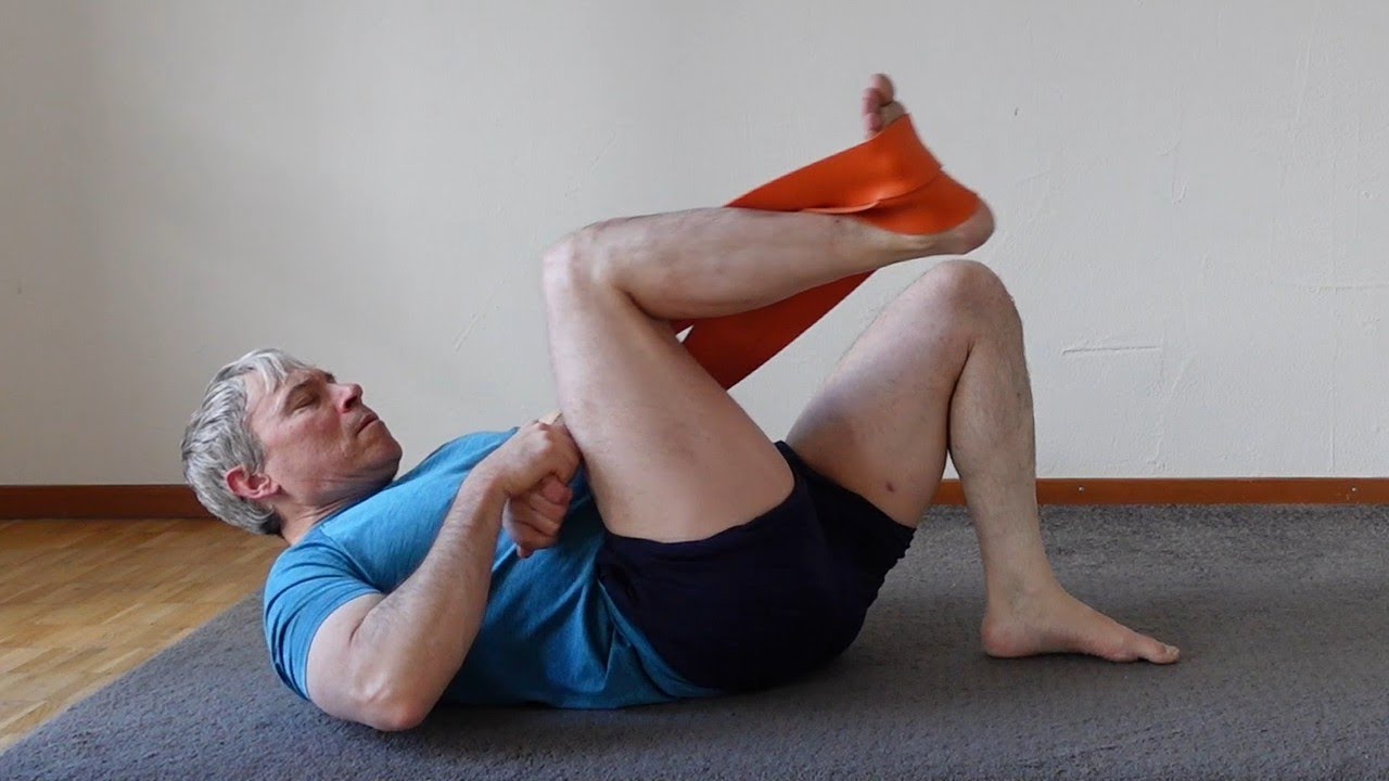 Train quads and glutes with resistance band leg presses