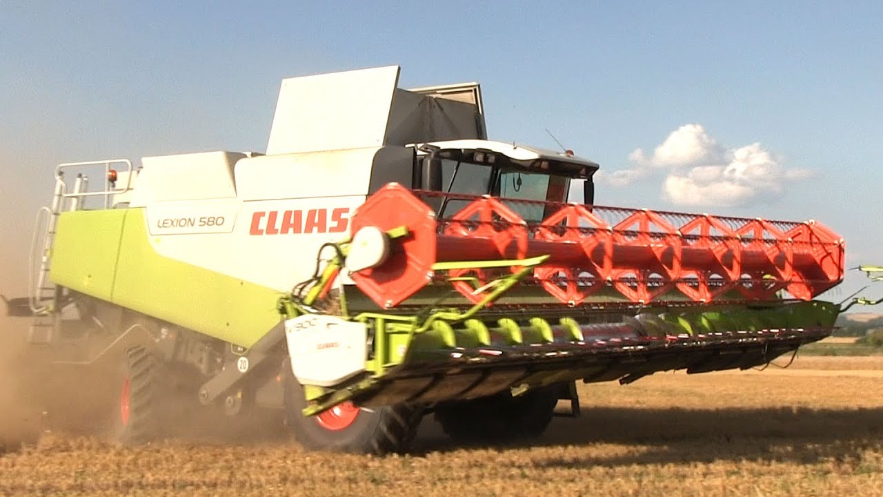 Claas Lexion 580 mit 9 Meter Schneidwerk (V900) sowie Hawe Überladewagen