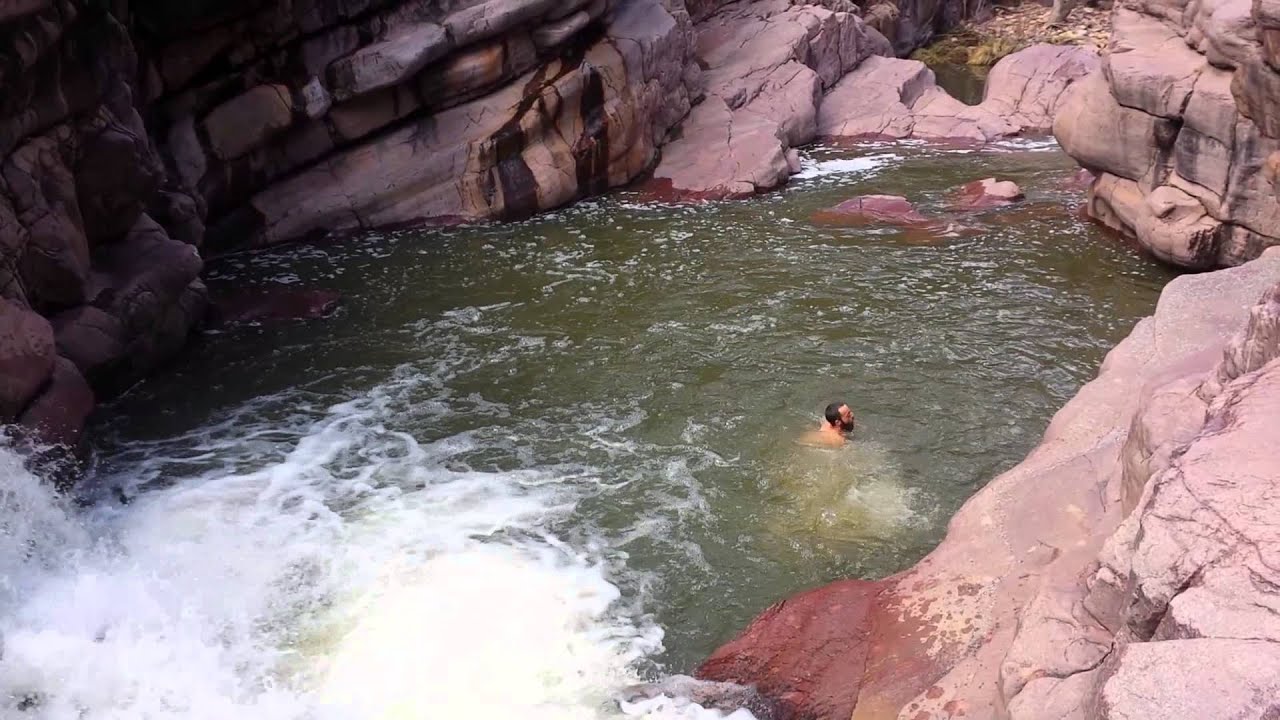 Mike jumping into Christopher Creek Gorge