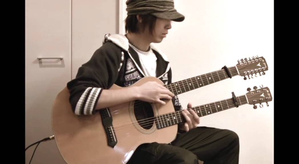 T-cophony plays the double-neck guitar 