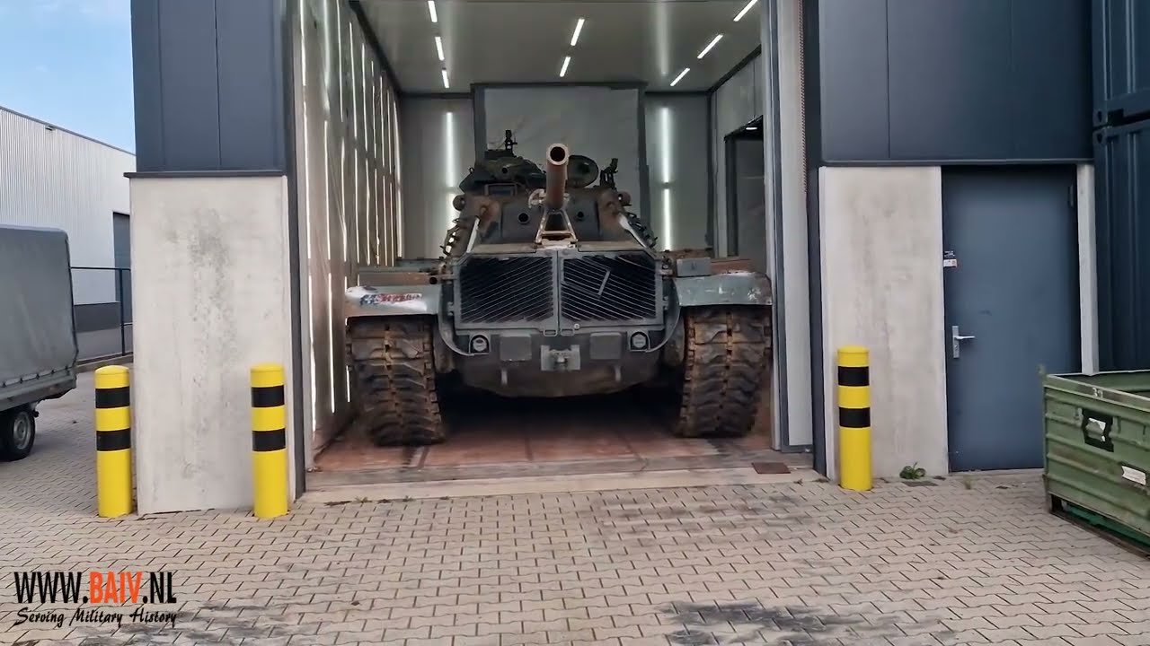 Moving the M60 Patton from the workshop to the spray booth.