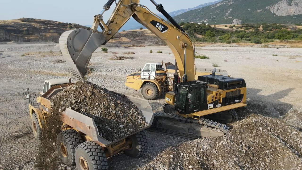 Caterpillar 374D Excavator Loading Caterpillar 730 And 740 Articulated Dump Trucks - Interkat SA