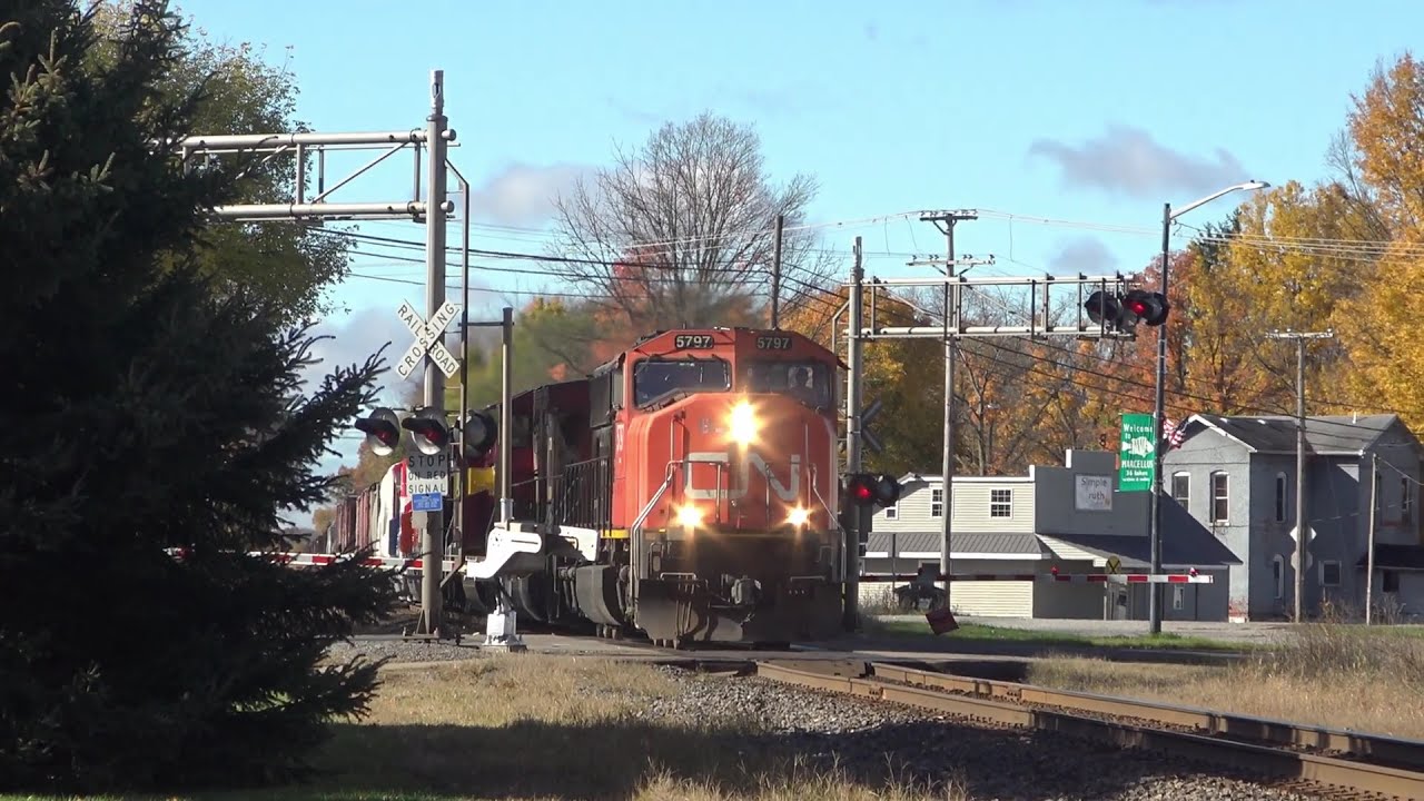 M396 with the new CN heritage units in tow take the siding at Marcellus, Michigan.