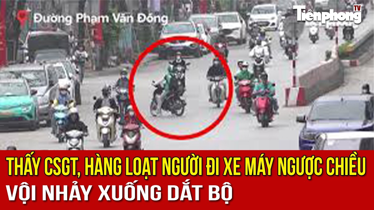 Thấy CSGT, hàng loạt người đi xe máy ngược chiều vội nhảy xuống dắt bộ