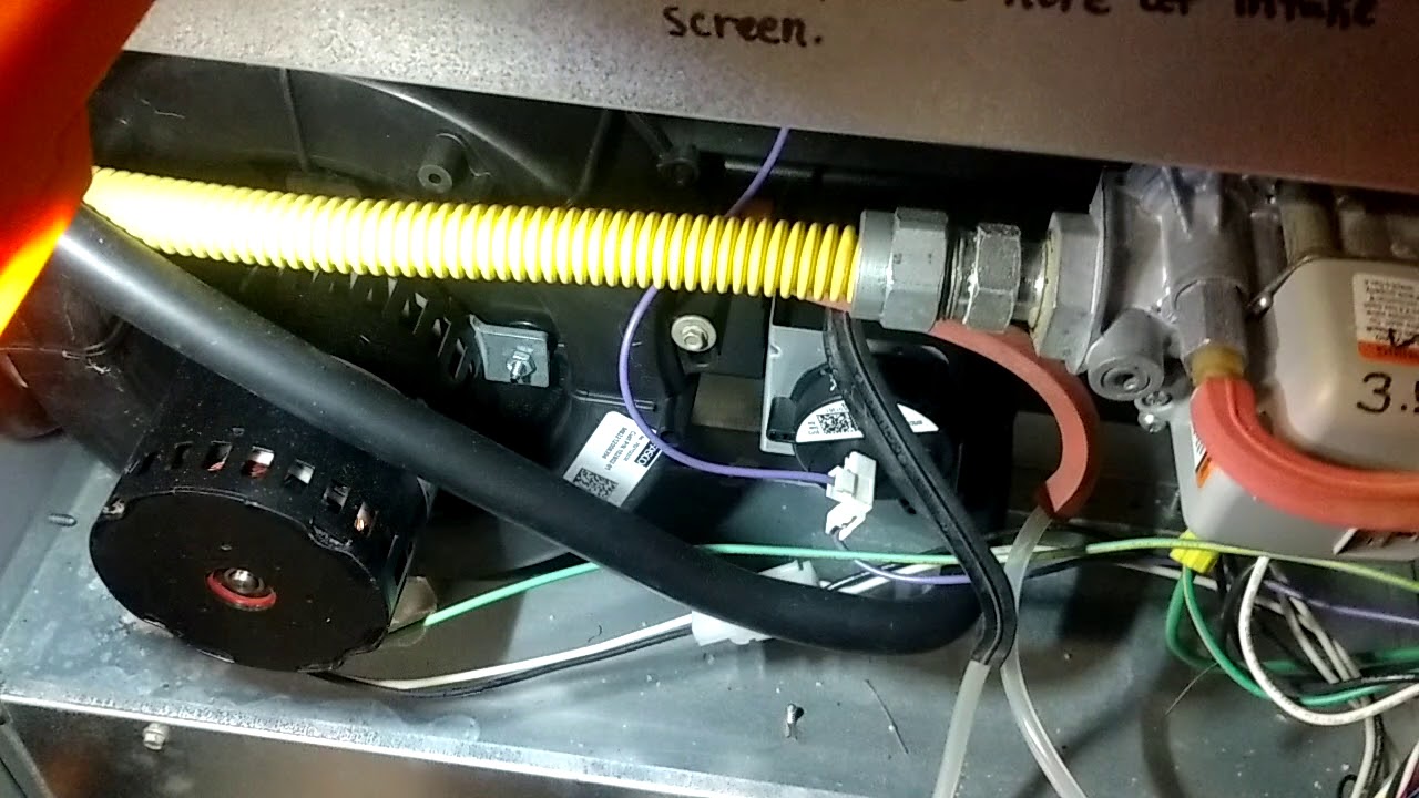 Checking the draft on a Lennox cold collector box w/ a dual-port Chinese manometer. Very useful tool