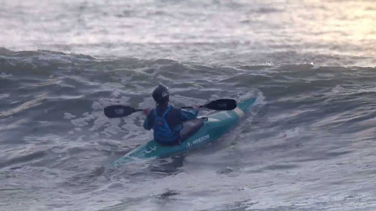 Kayakers surfing South Beach in Aberystwyth - October 2023