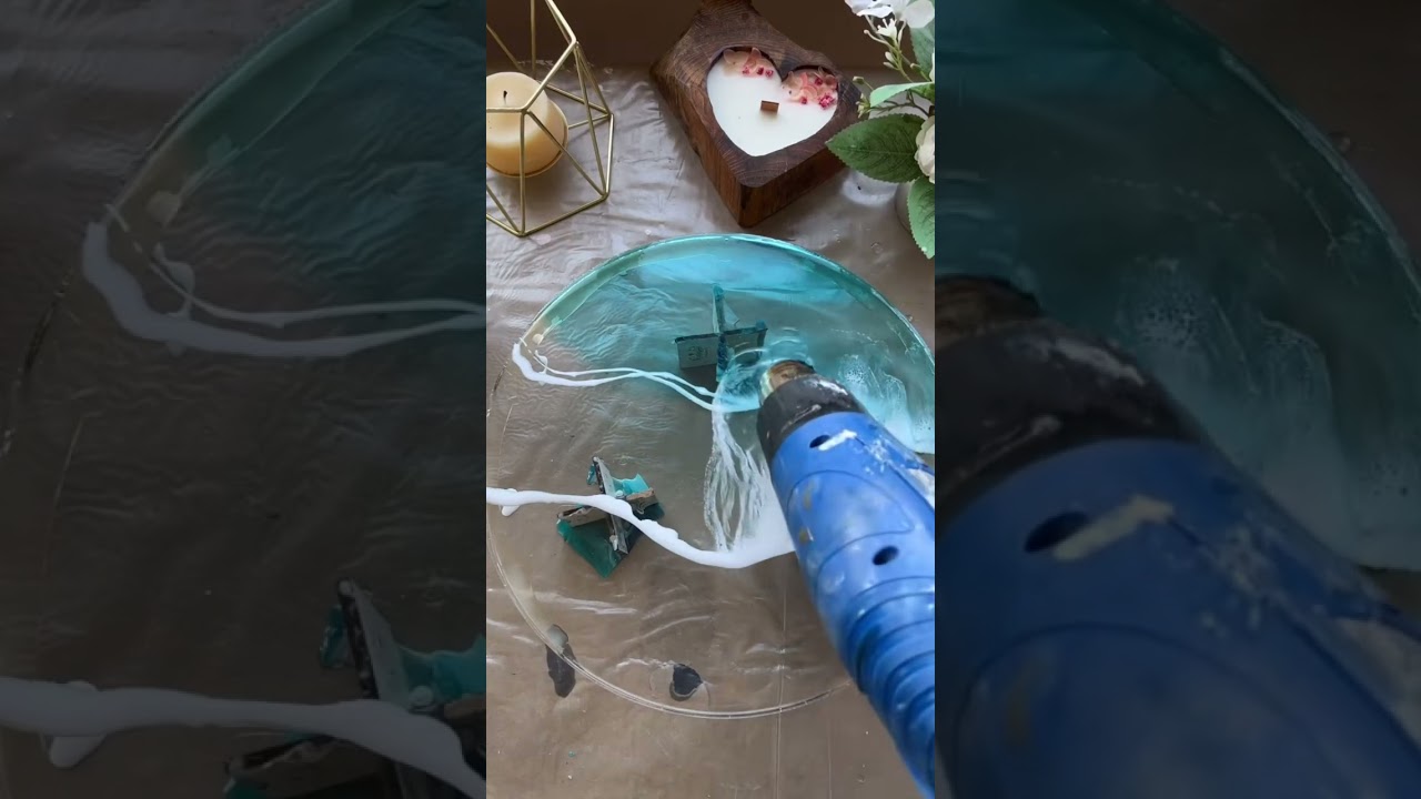Learn how to create mesmerizing ocean waves on a resin table using epoxy resin. This step-by-step