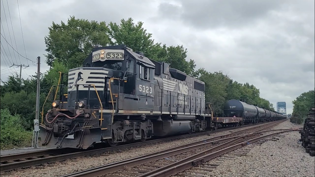 A GP38-2 Pulls NV03 Past Shell Road With An RS3L And A Caboose