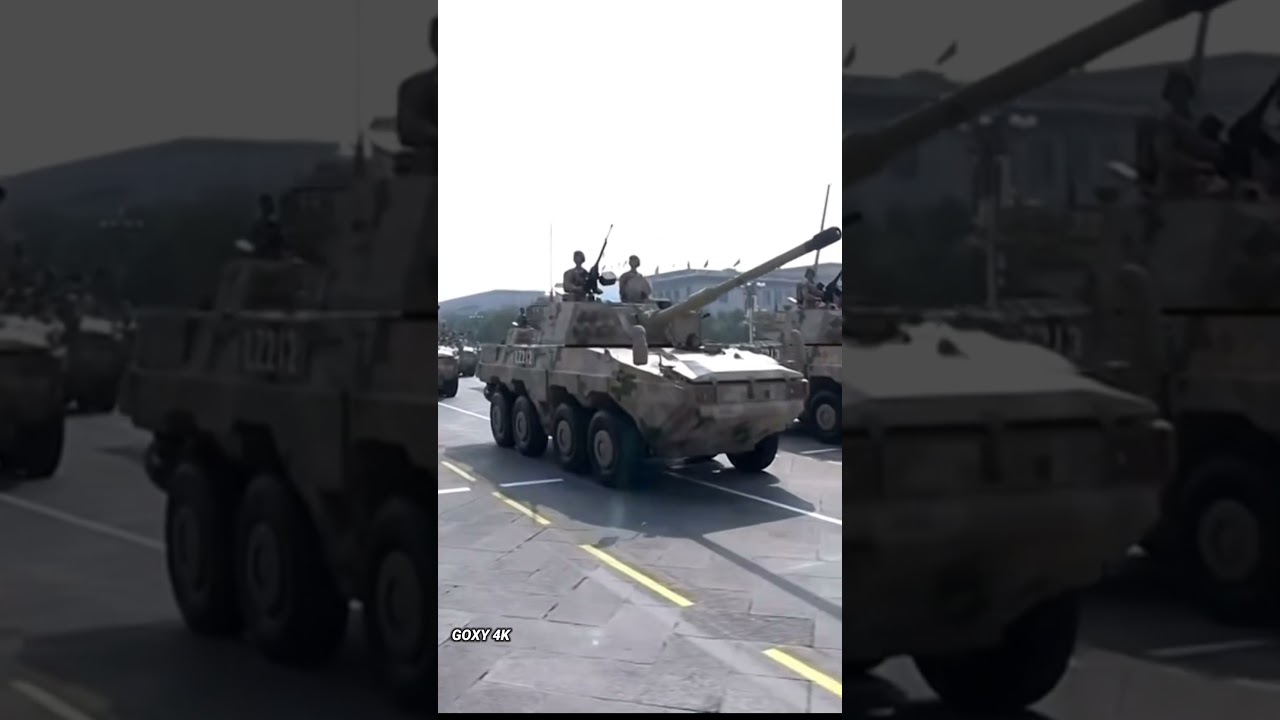 The solemn parade of military tanks affirms the steel strength and national defense power.
