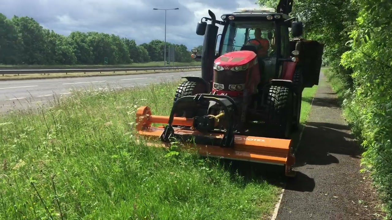 Massey Ferguson 6616 tractor cutting highway verges with front mounted Votex Roadmaster flail mower