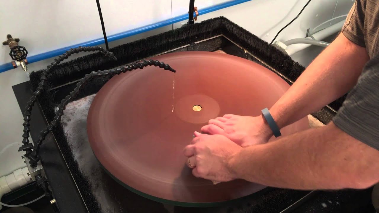 Grinding a block of glass from rough grind to final polish