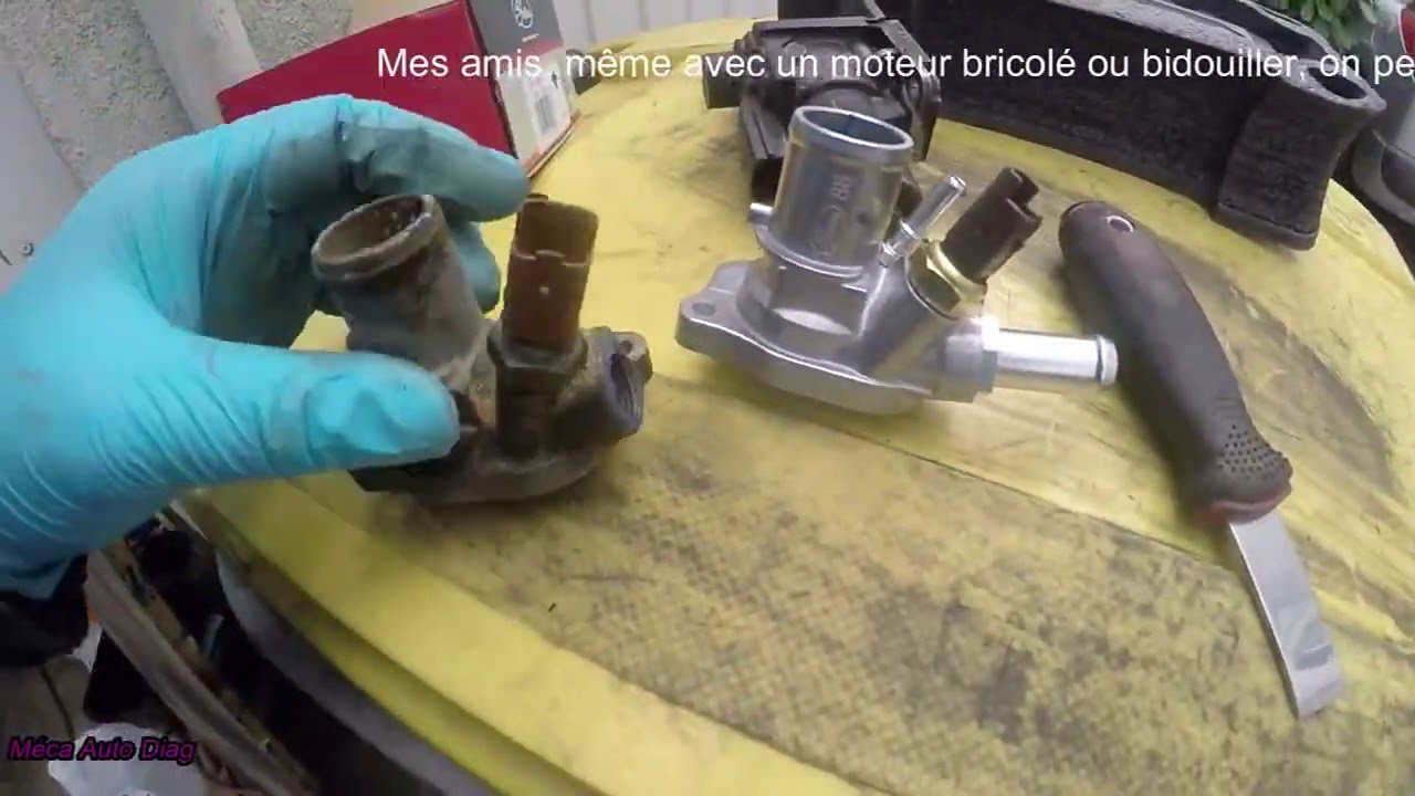 Remplacé un Thermostat/Calorstat et purge du circuit de refroidissement