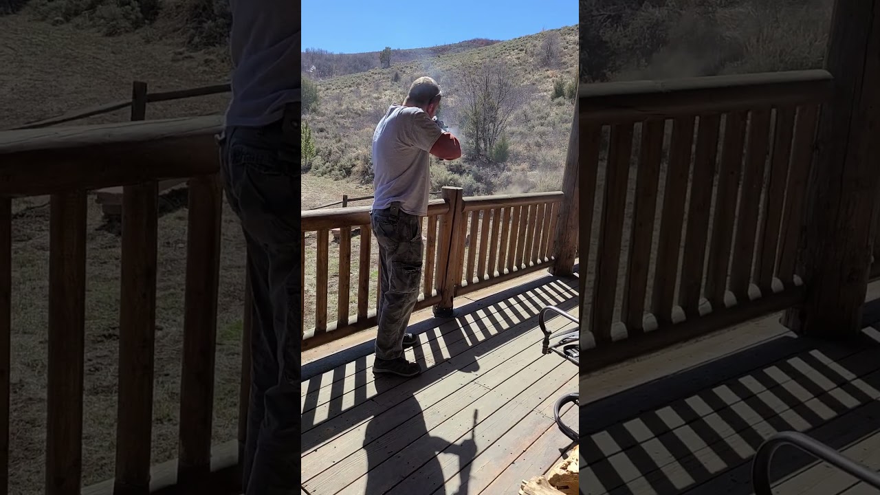 shooting the AK47 at the cabin.