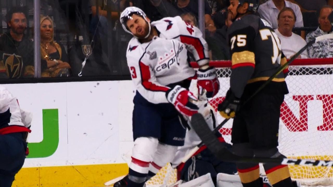 Tom Wilson eats the stick and gloves of Ryan Reaves