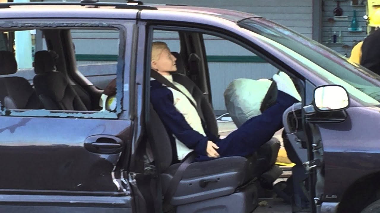 Legs on dash of van when airbag deploys