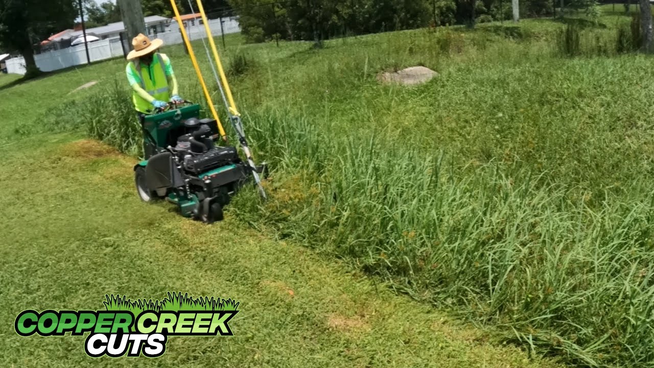 Mowing Tall Grass At Abandoned Commercial Building (Found something surprising in the shrubs)