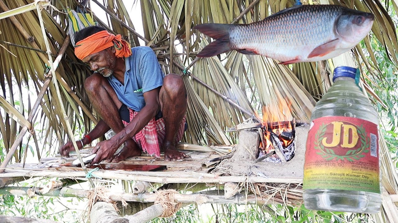 Fish cooking hungry man eating with wine in Tree house #allindiatribefood #villagecooking 