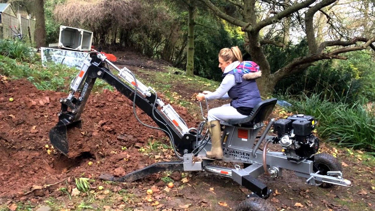 Blonde Women Operating the Jansen MB-300 Mini Excavator