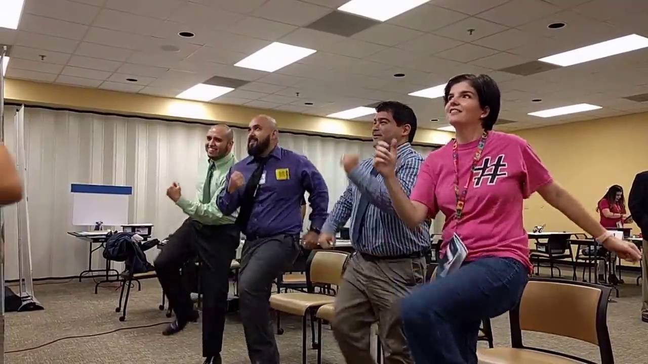 Software Engineers and a teacher dancing to GoNoodle.com