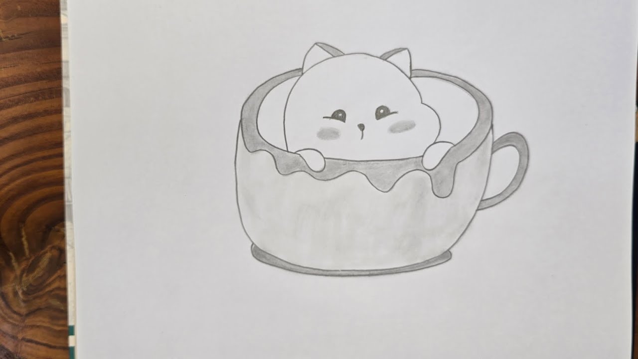 Cute cat in a cup