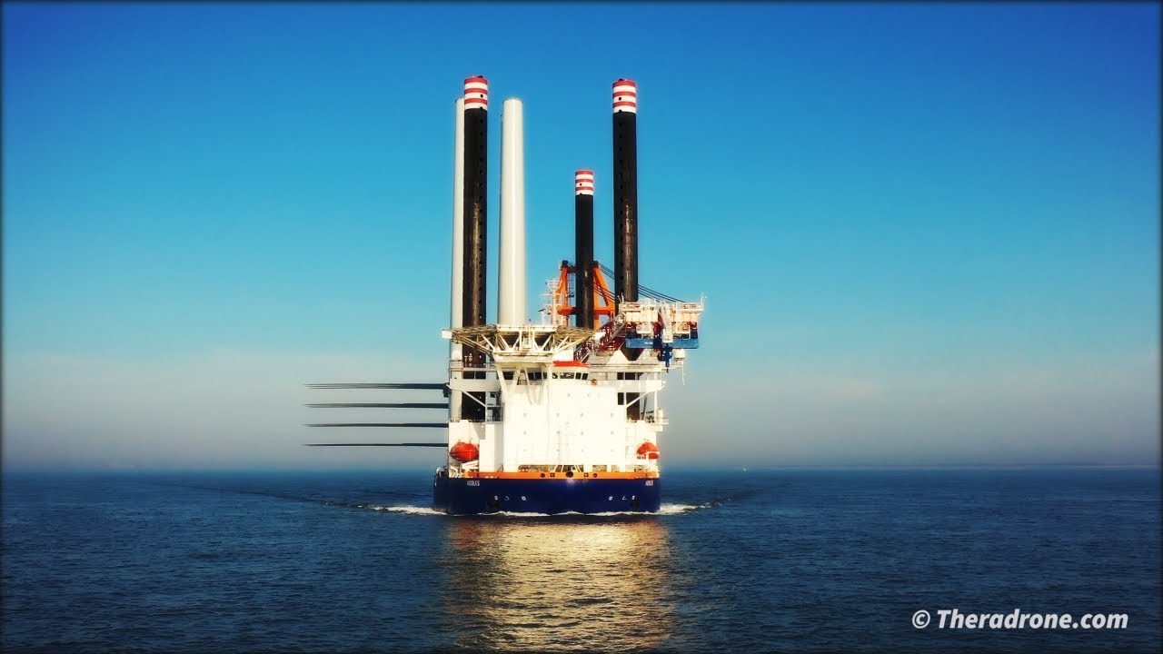 Offshore Supply Ship AEOLUS (Van Oord) fades into the sunlight at sea. (4K)