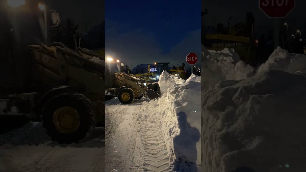 CATERPILLAR Backhoe GRABS Big Chunk of Snow Goldie Mohr Ltd