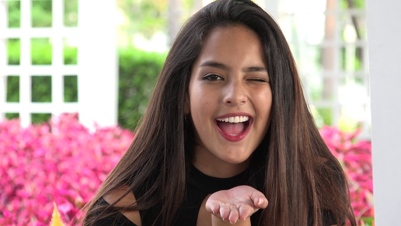 Teen Girl Blowing A Kiss And Winking