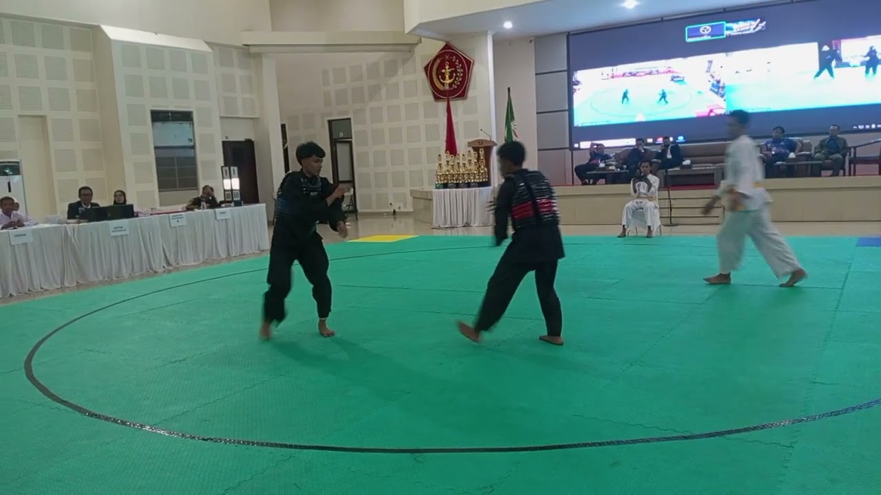 jinan ( pesilat sudut biru) , Kejuaraan Silat Dansesko TNI 2026, partai semifinal 