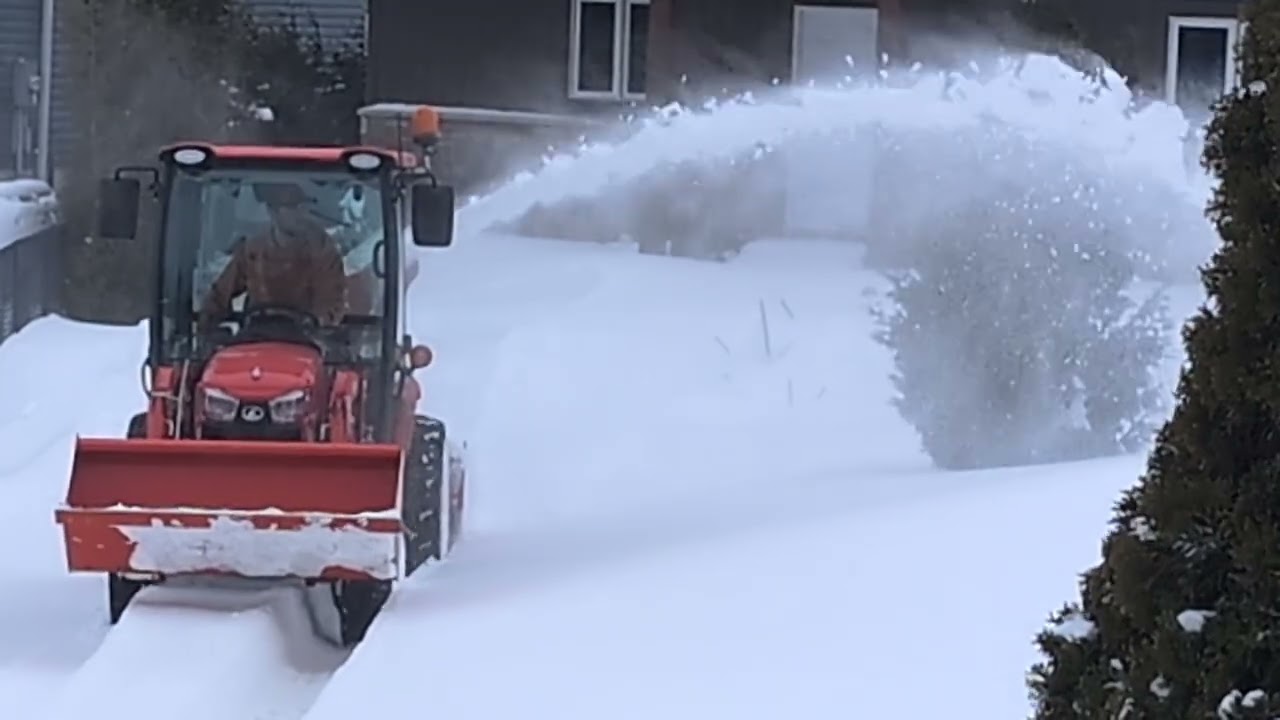 Kubota LX2620 snow blowing.