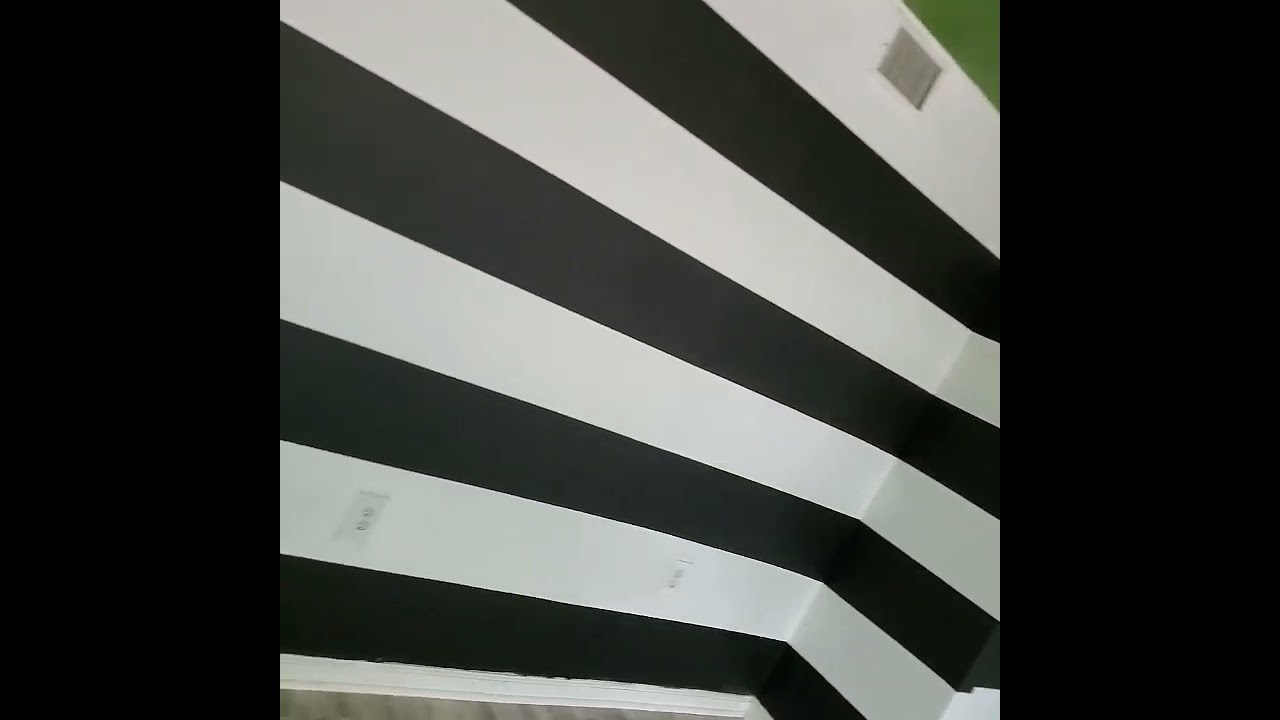 job completed ‼️ white & black horizontal stripes with green ceiling. Chalkboard walls around stairs