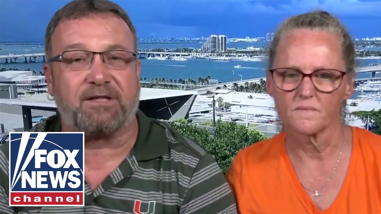 Miami couple uses American flag to catch falling cat at football game
