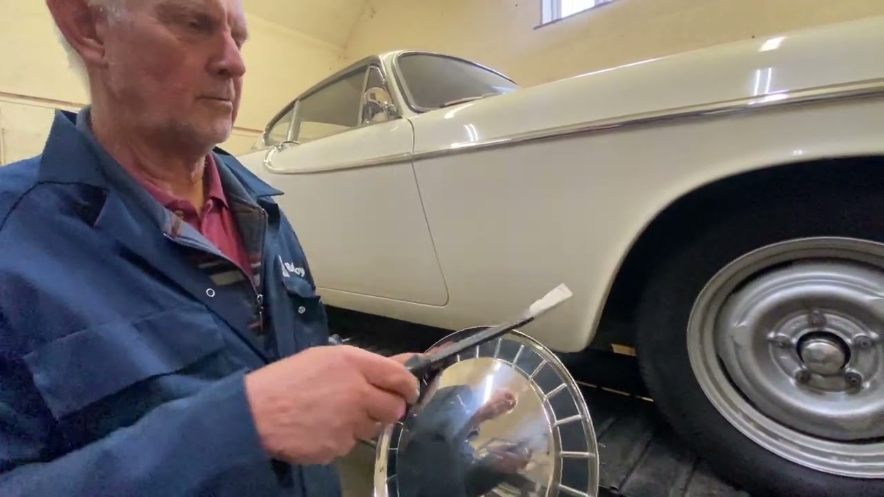 Volvo P1800 wheel trims on Jensen built car