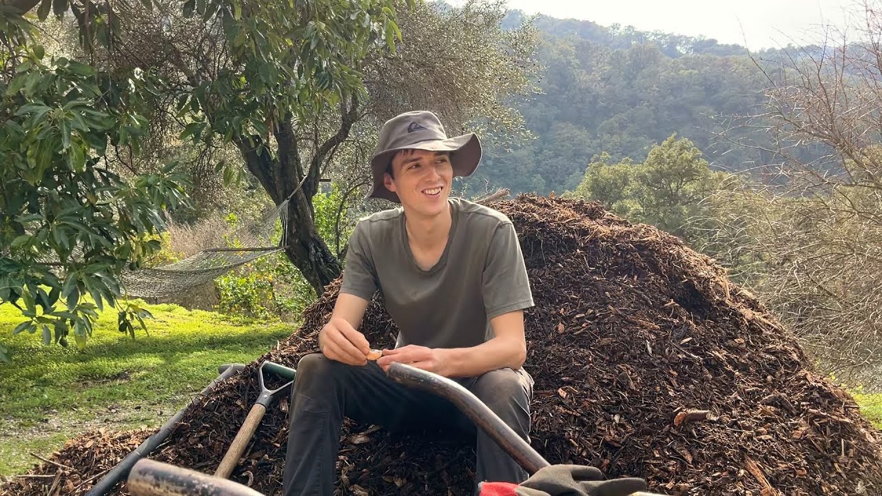Working on the land (adding mulch, planting fruit trees etc)