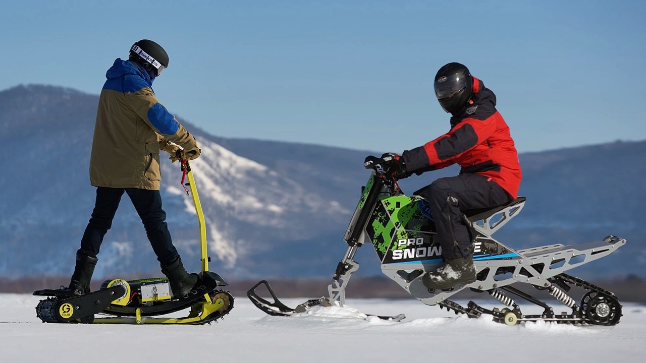 Electric snowmobiles, snowbikes and snowboards in one epic battle!
