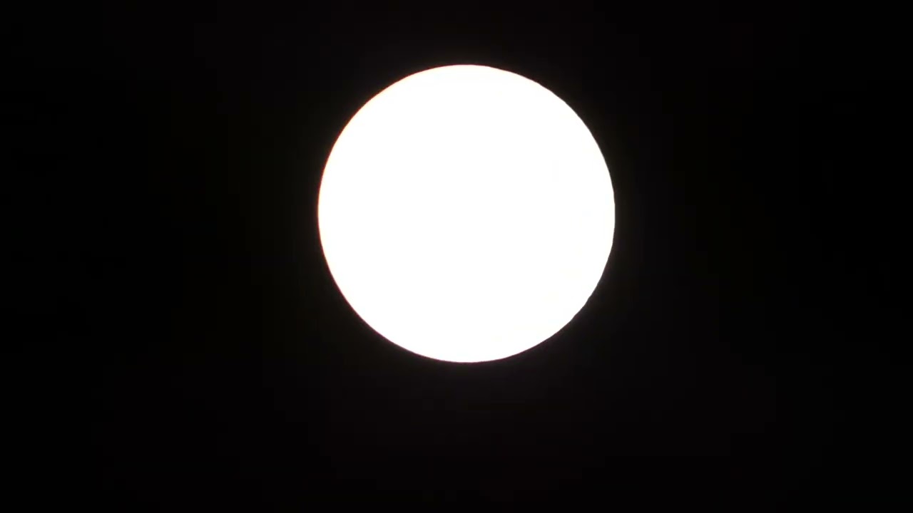 A bright Full Snow Moon shining in Nighttime for 4 minutes