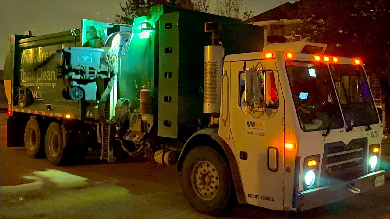 Ex OKC Mack LEU First Gen McNeilus ZR Automated Side Loader Garbage Truck at Night in Fort Worth TX