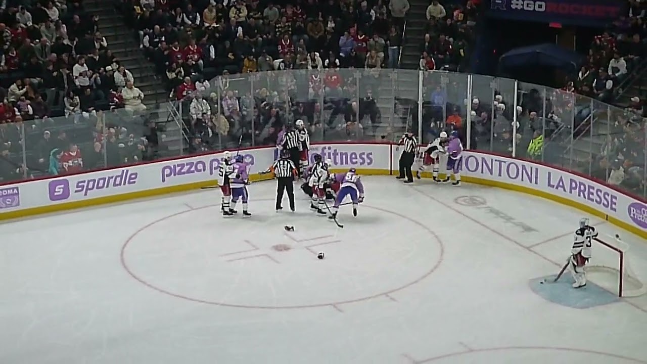 Laval Rocket's Joshua Roy shoots puck after the whistle and Hartford Wolf Pack players don't like it